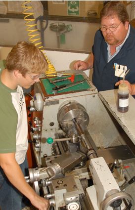 apprentice on a lathe 